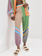 Calças Bloomers Largas com Impressão Única Colorida e Cintura Elástica com Bolsos